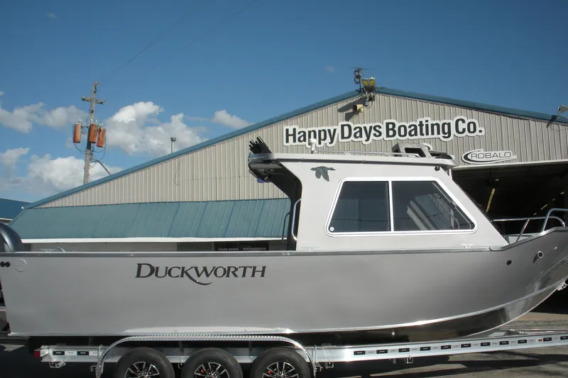 The Image of 2026 Duckworth 26 Pacific Pro boat displayed in a showroom on a trailer. - 0