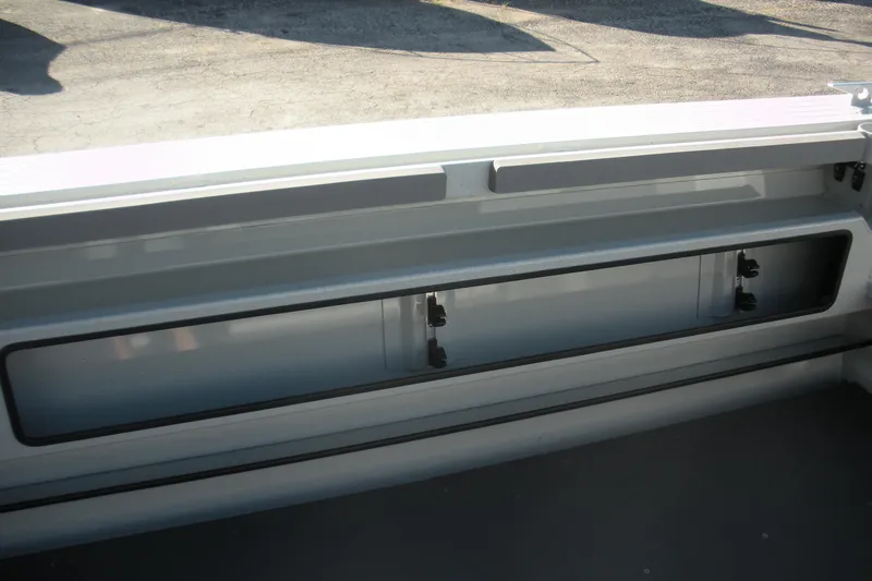 Slide: The Image of Open storage compartment on 2026 Duckworth 26 Pacific Pro boat. - 15