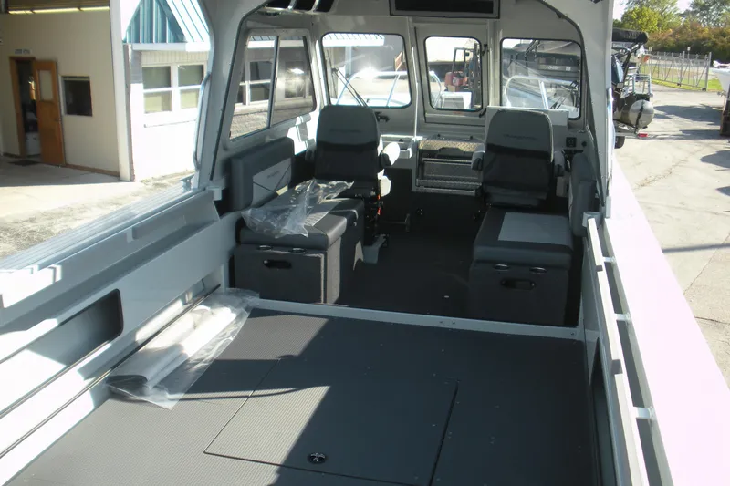 Slide: The Image of Open storage compartment on 2026 Duckworth 26 Pacific Pro boat. - 17