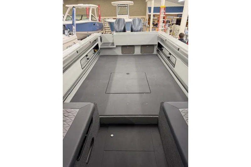 Slide: The Image of 2026 Duckworth 26 Pacific Pro boat interior with spacious deck and seating. - 23