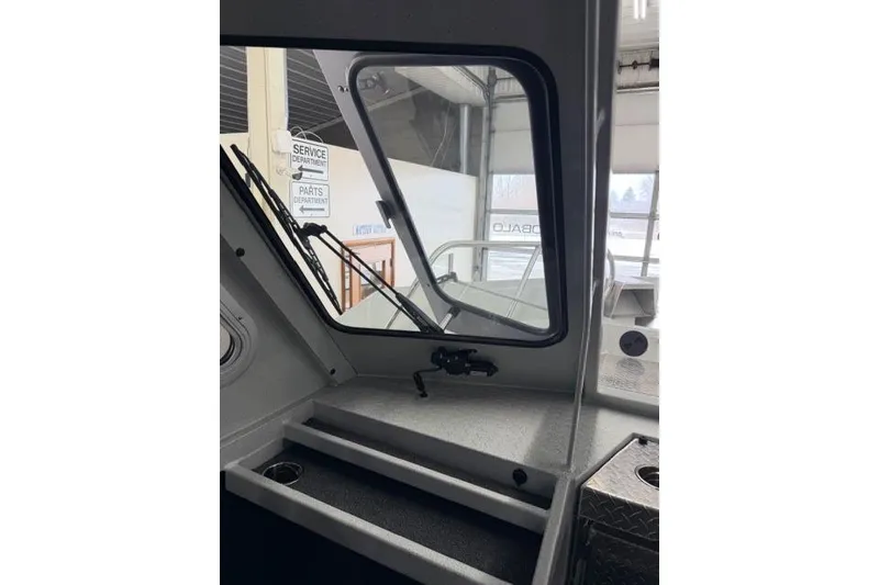 Slide: The Image of Interior view of 2026 Duckworth 26 Pacific Pro boat, showcasing windshield and dashboard. - 28