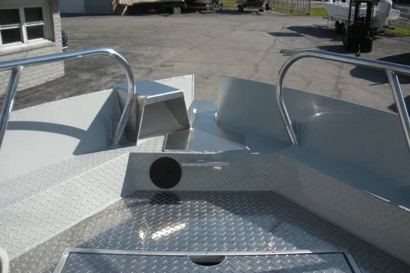 Slide: The Image of 2026 Duckworth 26 Pacific Pro boat on trailer, parked outside dealership under blue sky. - 5