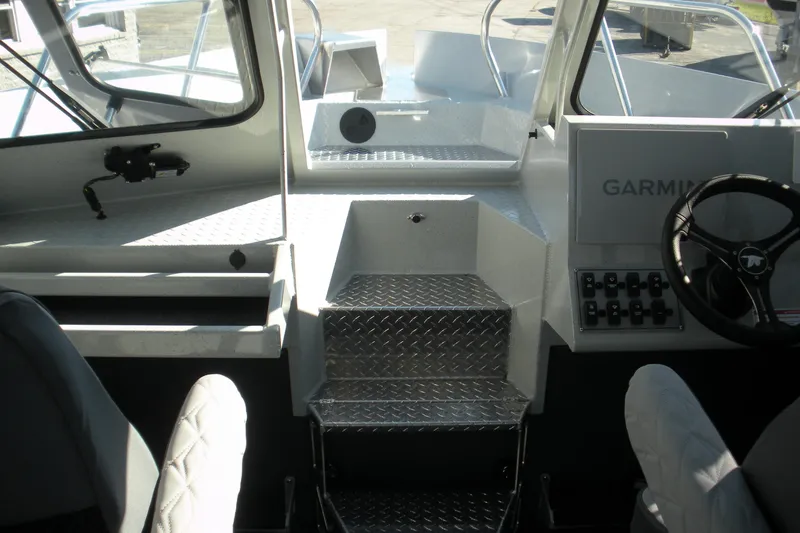 Slide: The Image of Bow of 2026 Duckworth 26 Pacific Pro boat with diamond plate flooring. - 6