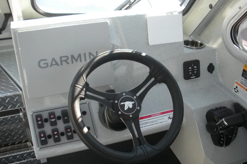 Slide: The Image of Interior of 2026 Duckworth 26 Pacific Pro boat with Garmin navigation system. - 7