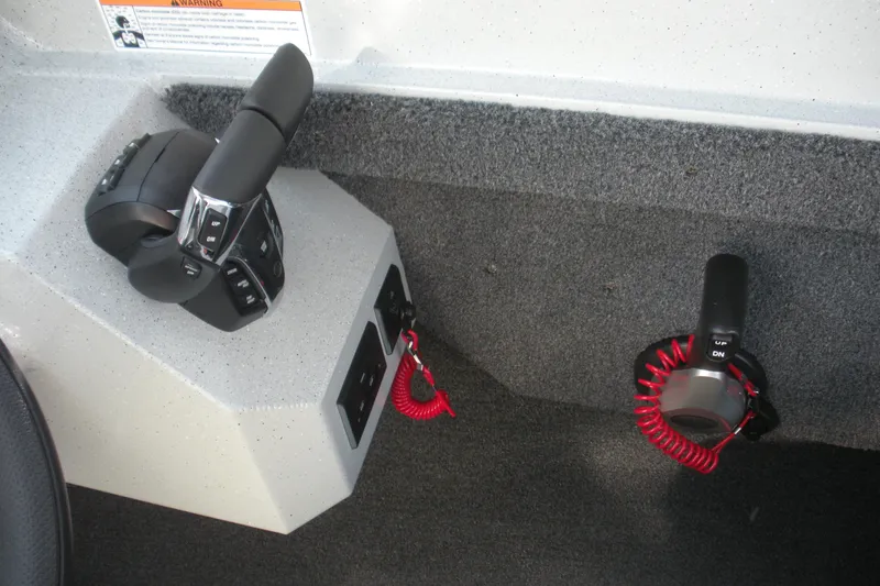 Slide: The Image of Control panel on 2026 Duckworth 26 Pacific Pro boat, featuring Lectrotab trim tab switches. - 9