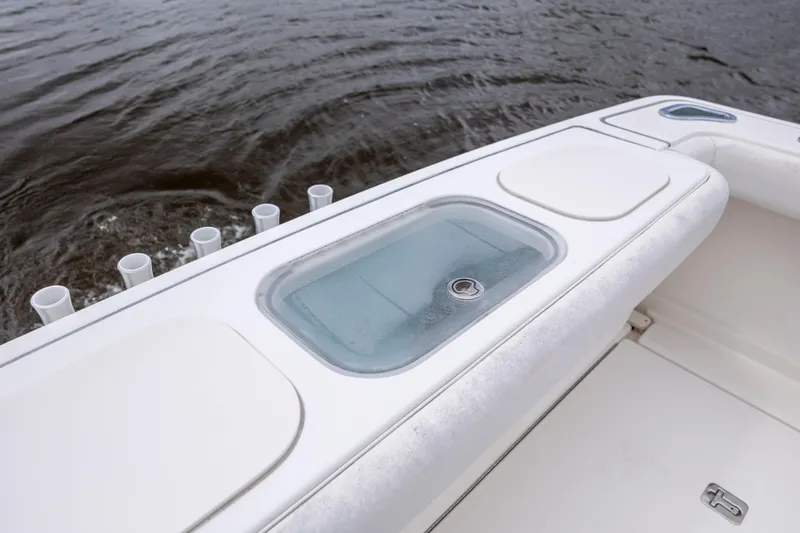 Slide: The Image of 2004 Tiara Yachts 3200 Open boat deck with livewell and rod holders. - 17