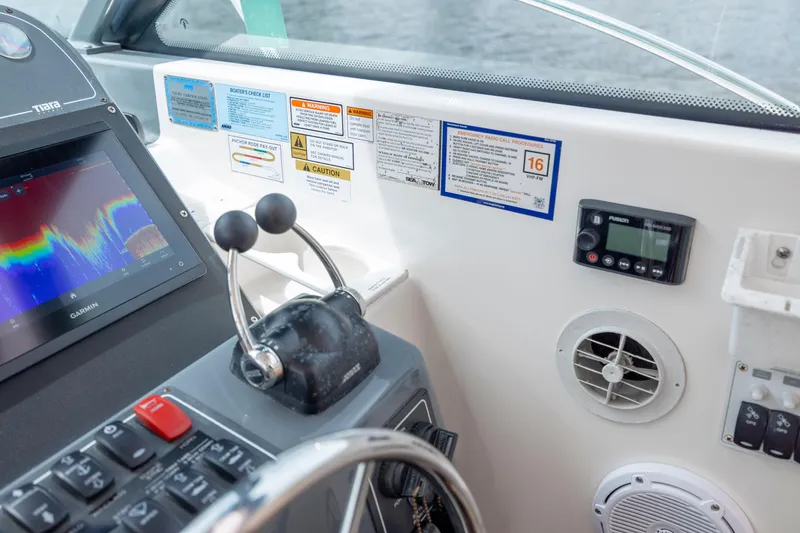 Slide: The Image of 2004 Tiara Yachts 3200 Open helm with Garmin display and control panel. - 26