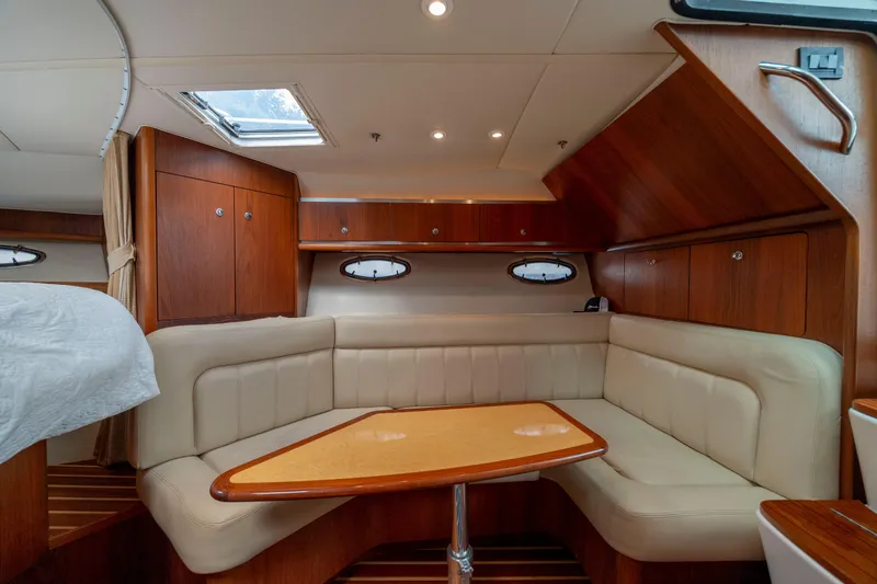 Slide: The Image of Luxurious interior of 2004 Tiara Yachts 3200 Open with elegant wood and leather seating. - 28