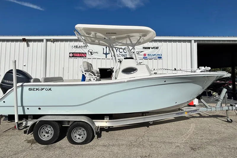 The Image of 2021 Sea Fox 249 Avenger boat on trailer, parked outside marine shop. - 0