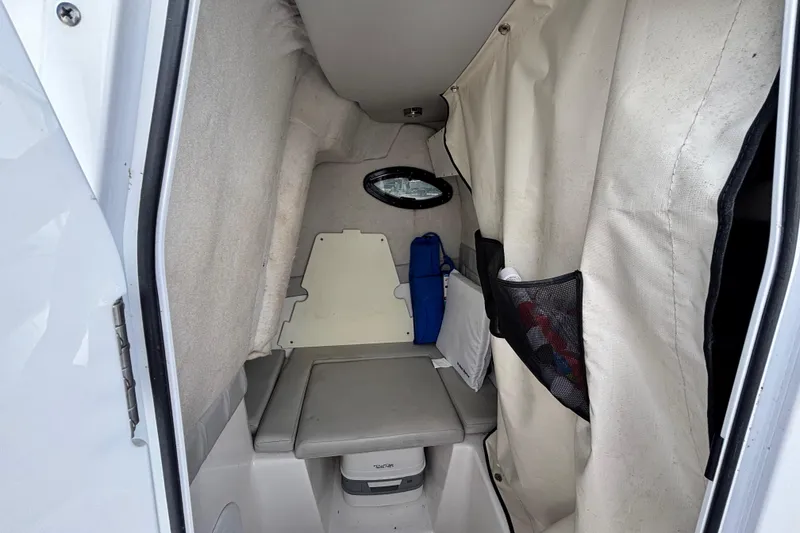 Slide: The Image of 2021 Sea Fox 249 Avenger cabin interior with seating and storage compartments. - 15