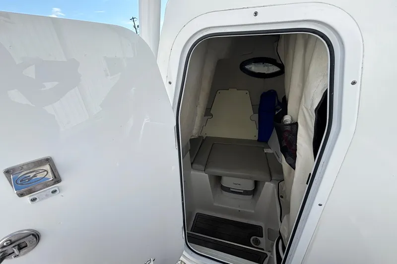 Slide: The Image of 2021 Sea Fox 249 Avenger cabin interior with compact seating and storage. - 19