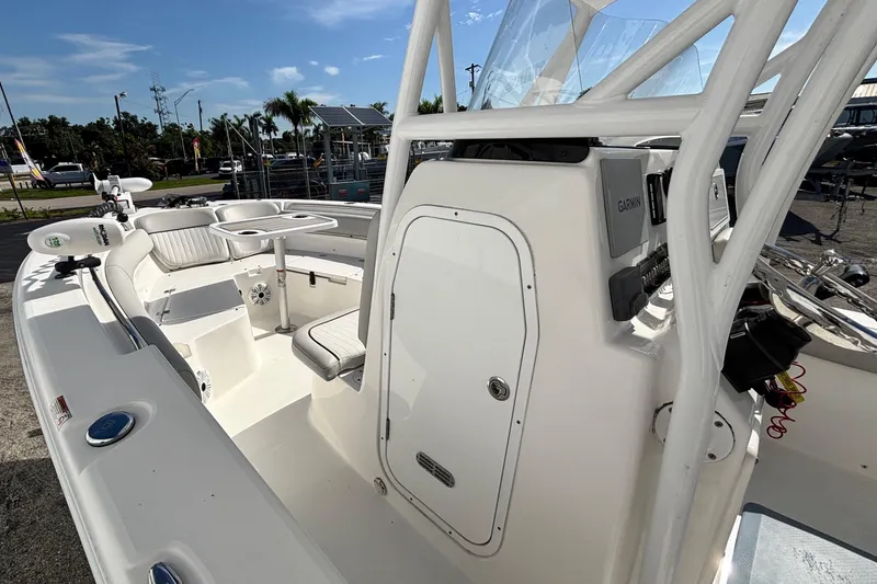 Slide: The Image of 2021 Sea Fox 249 Avenger boat interior with seating and Garmin equipment. - 20