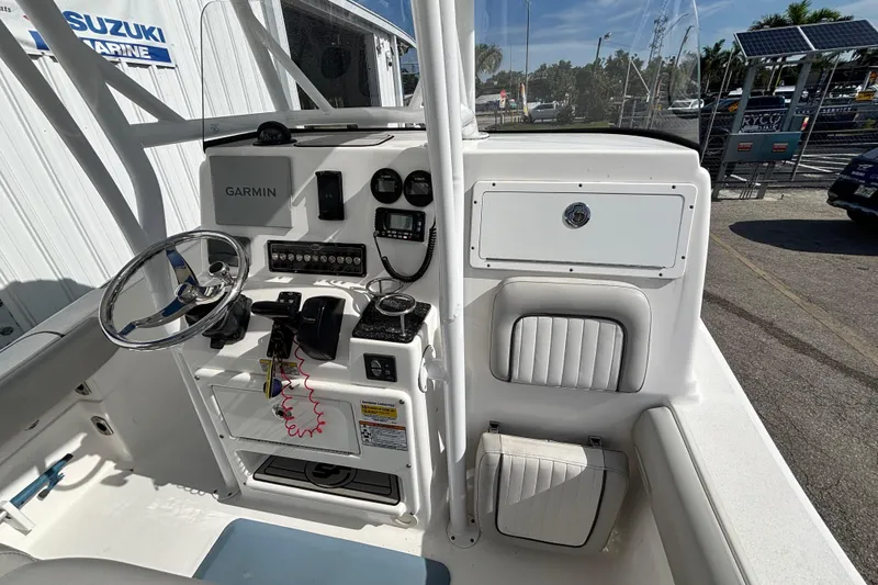 Slide: The Image of 2021 Sea Fox 249 Avenger boat cockpit with Garmin navigation and control panel. - 26