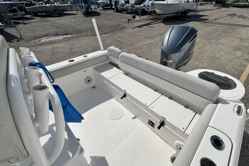 Slide: The Image of 2021 Sea Fox 249 Avenger boat interior with seating and outboard motor. - 31