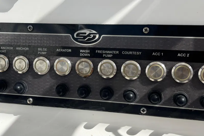 Slide: The Image of Control panel of a 2021 Sea Fox 249 Avenger boat with labeled switches. - 38