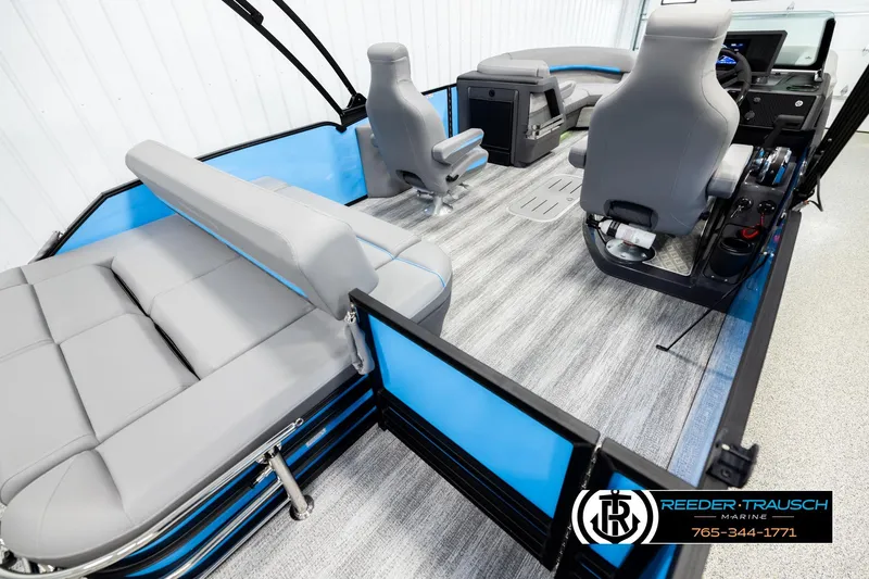 Slide: The Image of 2026 Bennington 22 MSBSE pontoon boat interior with gray seating and modern dashboard. - 12