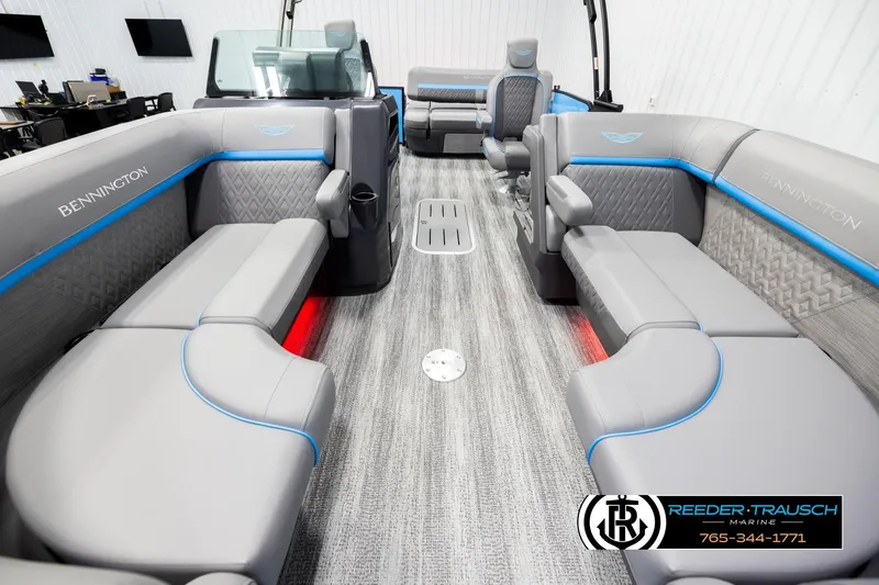 Slide: The Image of 2026 Bennington 22 MSBSE pontoon boat interior with gray seating and blue accents. - 13