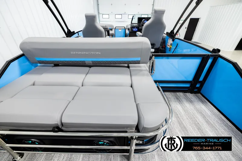 Slide: The Image of 2026 Bennington 22 MSBSE pontoon boat interior with gray seating and blue accents. - 16