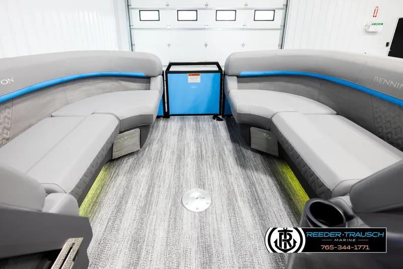Slide: The Image of Interior of 2026 Bennington 22 MSBSE pontoon boat with gray seating and blue accents. - 18
