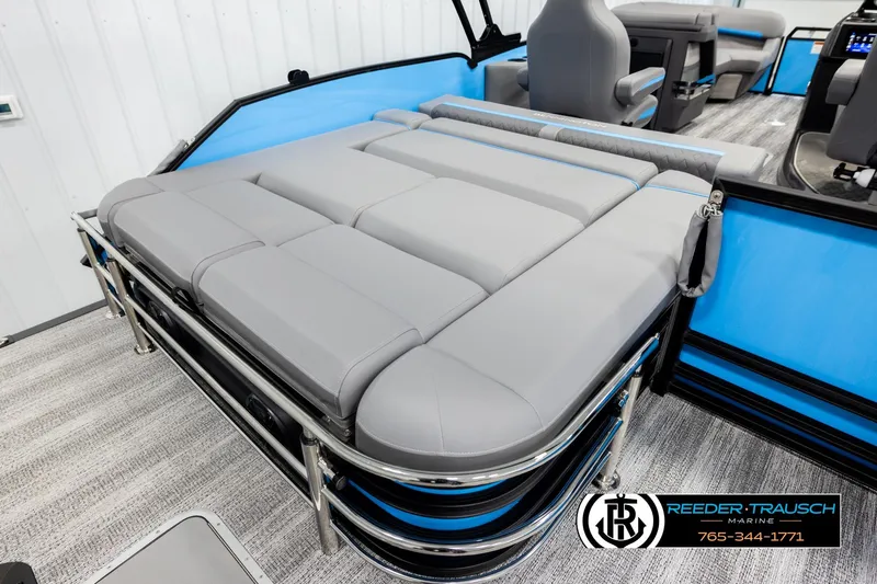 Slide: The Image of 2026 Bennington 22 MSBSE pontoon boat interior with gray seating and blue accents. - 21