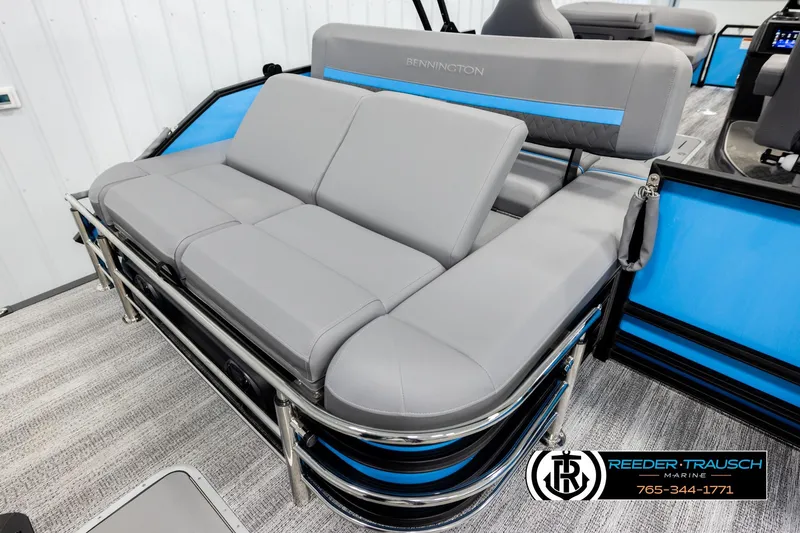 Slide: The Image of 2026 Bennington 22 MSBSE pontoon boat with sleek gray seating and blue accents. - 24