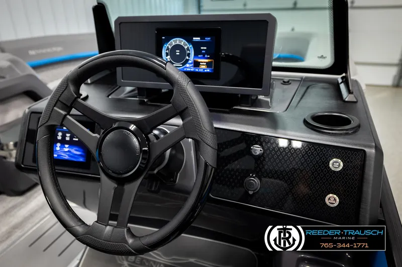 Slide: The Image of 2026 Bennington 22 MSBSE boat dashboard with modern steering wheel and digital display. - 29