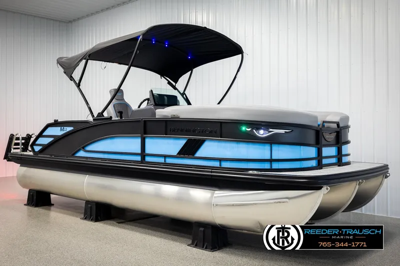 Slide: The Image of 2026 Bennington 22 MSBSE pontoon boat with canopy in showroom. - 3