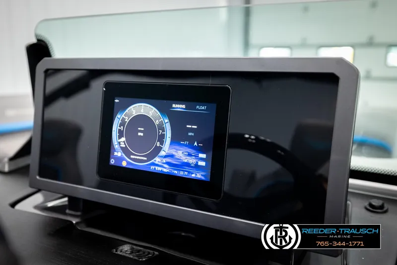 Slide: The Image of 2026 Bennington 22 MSBSE dashboard with digital display and controls. - 35