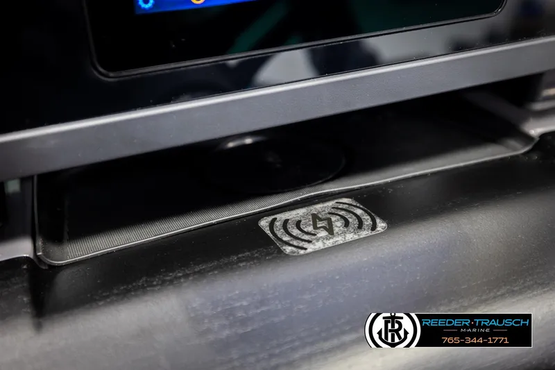 Slide: The Image of 2026 Bennington 22 MSBSE dashboard with wireless charging pad and display screen. - 36