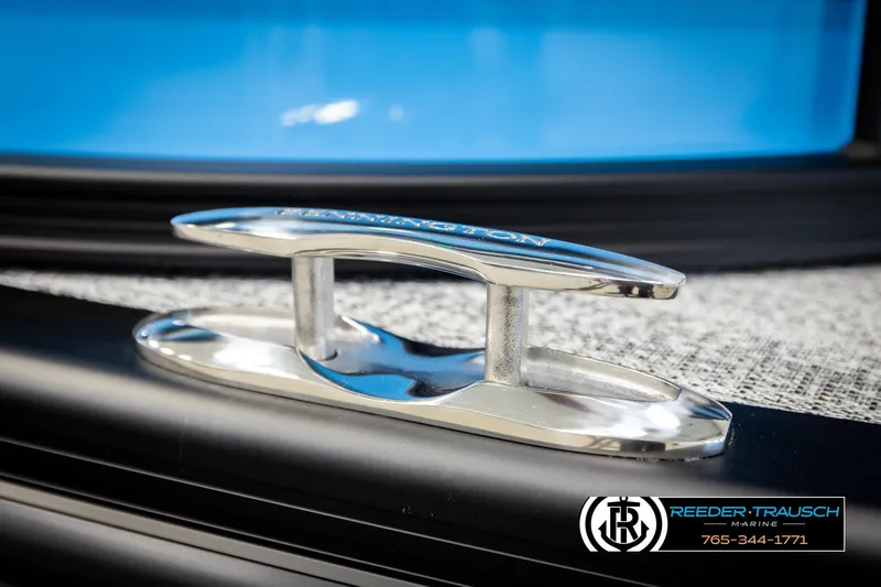 Slide: The Image of Close-up of a 2026 Bennington 22 MSBSE boat cleat with logo and contact details. - 52