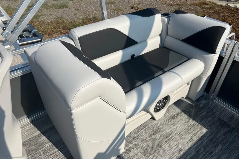 Slide: The Image of 2026 Tahoe Pontoon QUAD LOUNGE 1980, sleek design, in a warehouse setting. - 10