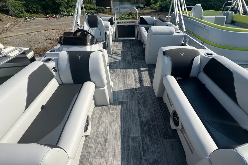 Slide: The Image of 2026 Tahoe Pontoon QUAD LOUNGE 1980 in a showroom, showcasing sleek design and modern features. - 6