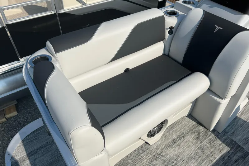 Slide: The Image of 2026 Tahoe Pontoon QUAD LOUNGE 1980 in a garage, showcasing sleek design and modern features. - 7