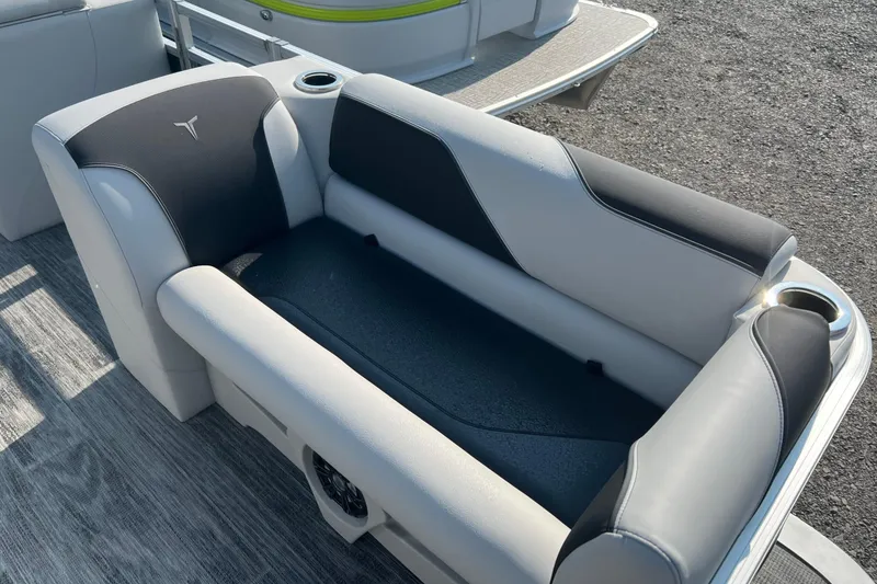 Slide: The Image of 2026 Tahoe Pontoon QUAD LOUNGE 1980 in a garage, rear view. - 8