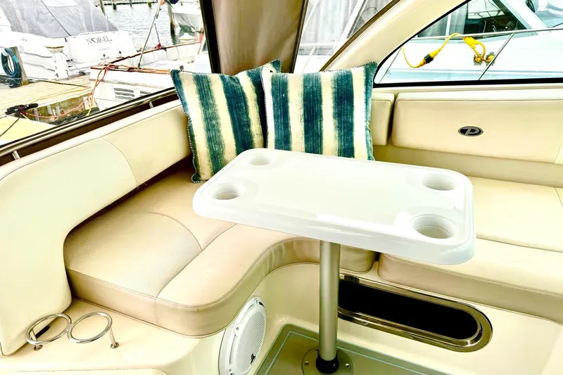 Slide: The Image of Luxurious interior of 2011 Pursuit OS 345 Offshore boat with seating and table. - 15