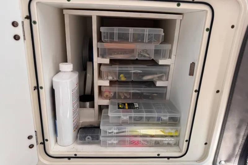 Slide: The Image of Fishing tackle storage on 2011 Pursuit OS 345 Offshore boat. - 34