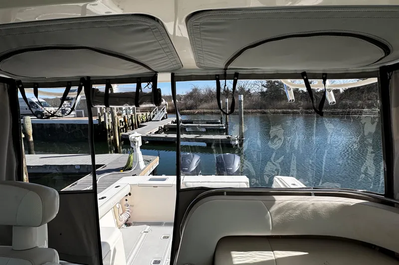 Slide: The Image of 2011 Pursuit OS 345 Offshore boat interior view at dockside marina. - 9
