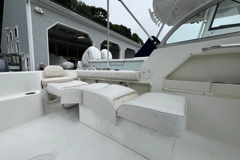 Slide: The Image of 2002 Hydra-Sports 202 DC boat interior with white cushioned seating and sleek design. - 21