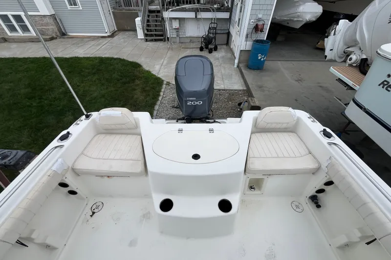 Slide: The Image of 2002 Hydra-Sports 202 DC boat interior with Yamaha 200 engine, featuring white seating and deck. - 22