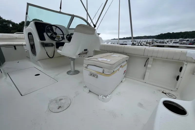 Slide: The Image of 2002 Hydra-Sports 202 DC boat interior with steering wheel and seating area. - 23