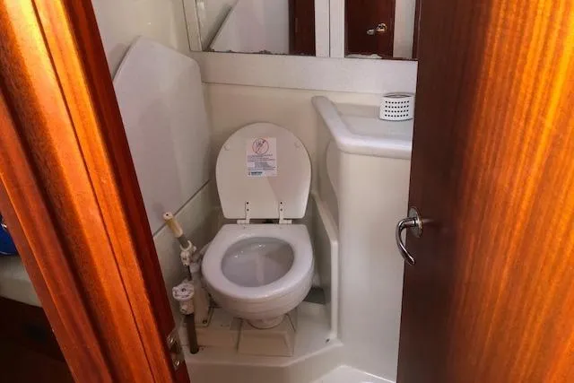 Slide: The Image of 1999 Sweden Yachts 45 bathroom with toilet and sink. - 13