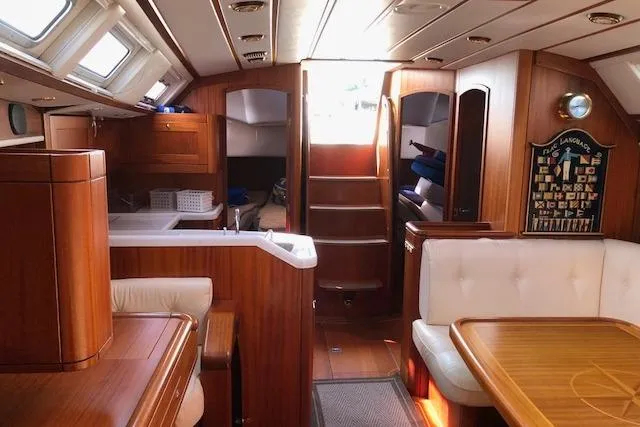 Slide: The Image of Luxurious interior of 1999 Sweden Yachts 45, featuring wood finishes and comfortable seating. - 16