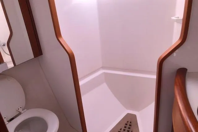 Slide: The Image of Bathroom interior of 1999 Sweden Yachts 45, featuring shower and toilet. - 19