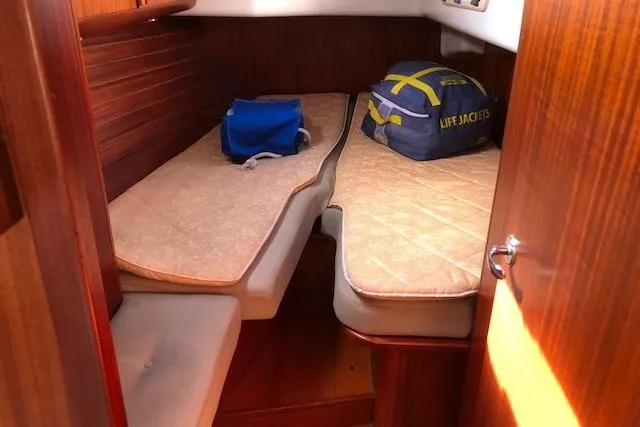 Slide: The Image of Cozy cabin interior of 1999 Sweden Yachts 45 with twin beds and life jackets. - 12