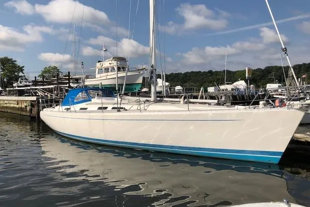 Slide: The Image of Sailing yacht docked at marina, Sweden Yachts 45, 1999 model, under clear skies. - 3