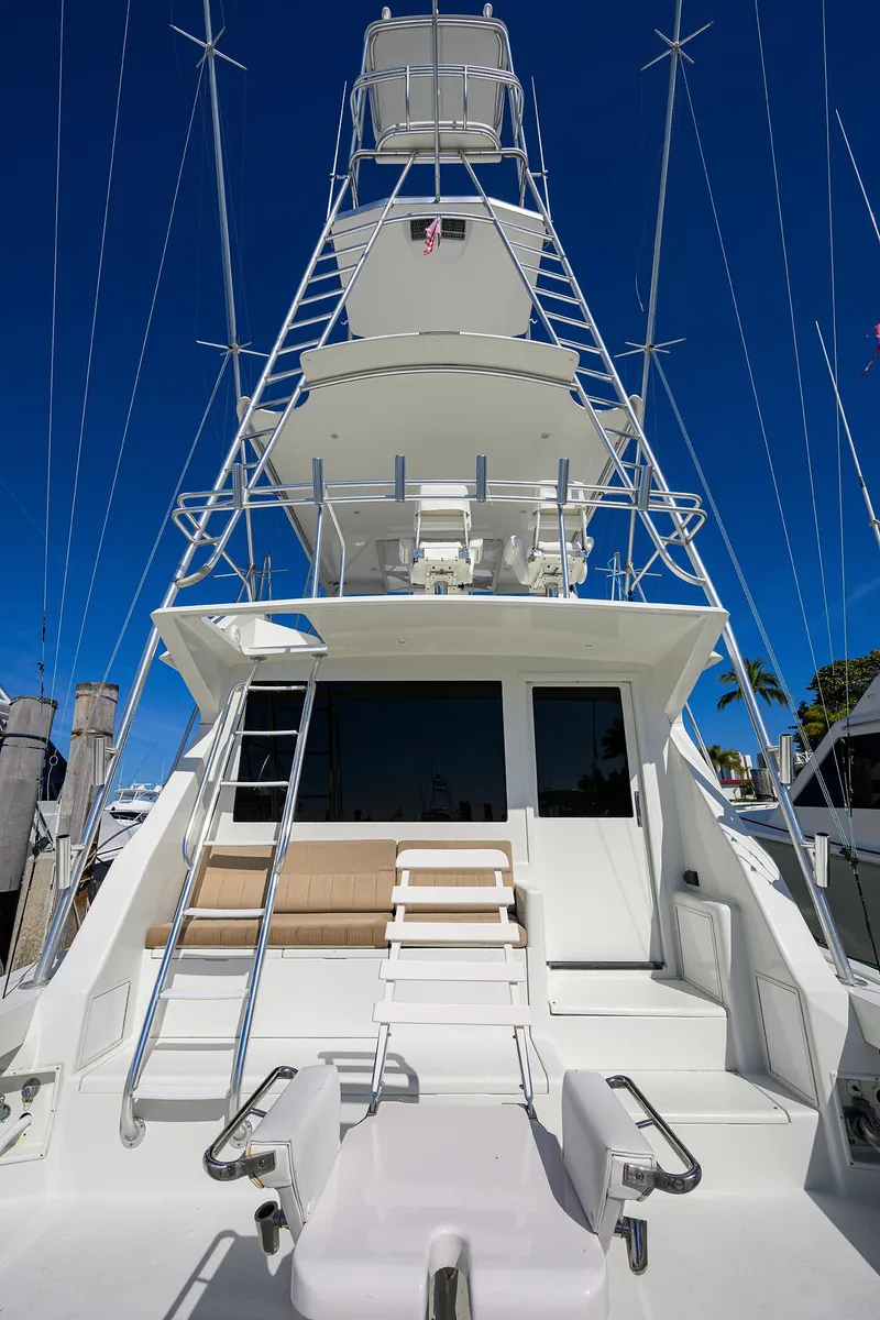 Slide: The Image of 1998 Viking 53 Convertible yacht with tower against clear blue sky. - 11