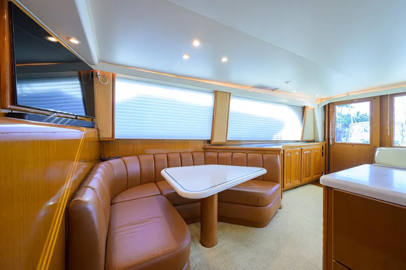 Slide: The Image of Luxurious interior of a 1998 Viking 53 Convertible yacht with leather seating and modern design. - 16