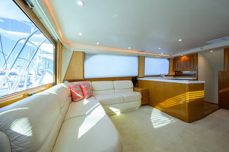 Slide: The Image of Luxurious interior of a 1998 Viking 53 Convertible yacht with plush seating and modern design. - 18