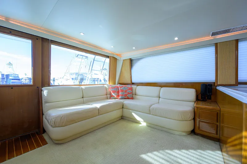 Slide: The Image of Luxurious interior of 1998 Viking 53 Convertible yacht with plush seating and natural light. - 19
