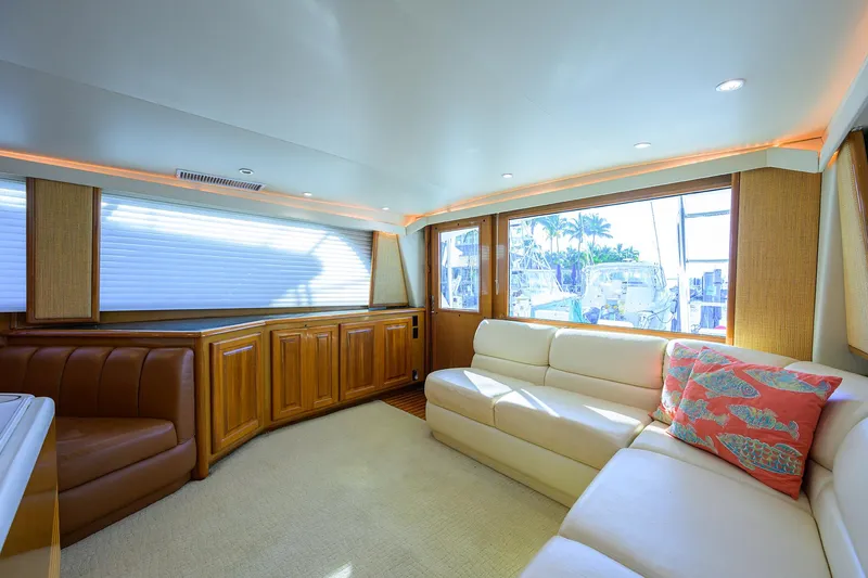Slide: The Image of Luxurious interior of 1998 Viking 53 Convertible yacht with plush seating and wood cabinetry. - 20